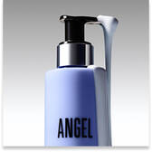 Close-up of a Mugler Angel body lotion pump bottle with white lotion on the dispenser.