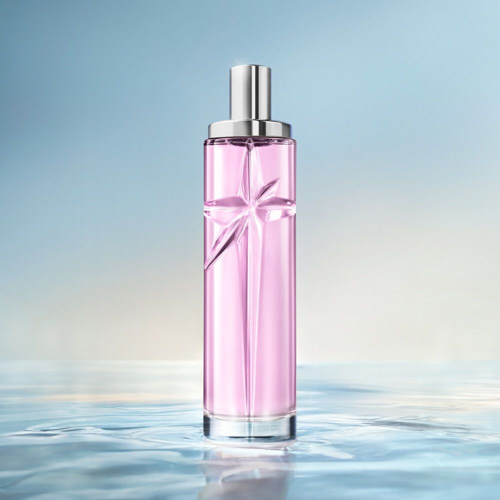 Starlicious Berry Licorice still life: slender glass bottle with strawberry, raspberry, pink flower and black licorice sticks on a soft pink rippling water background.