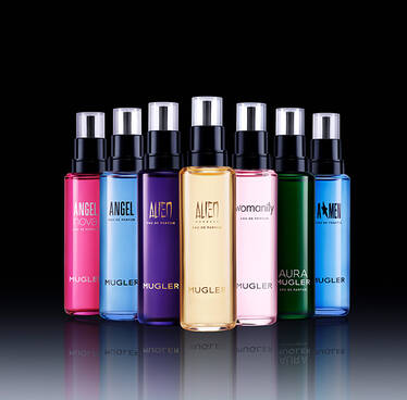 A collection of eight colorful perfume bottles arranged in a staggered formation against a black background, reflecting light on a shiny surface.