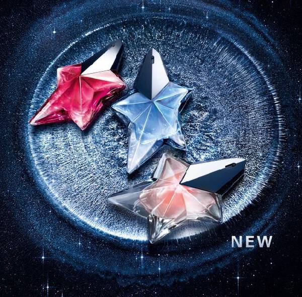 Three Mugler Angel star-shaped perfume bottles in pink, blue, and peach, displayed on a shimmering silver crater surface against a starry night sky background with the word ‘NEW.’