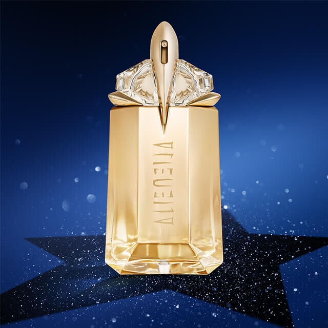 A golden perfume bottle with a geometric design and an elegant cap, set against a starry blue background.