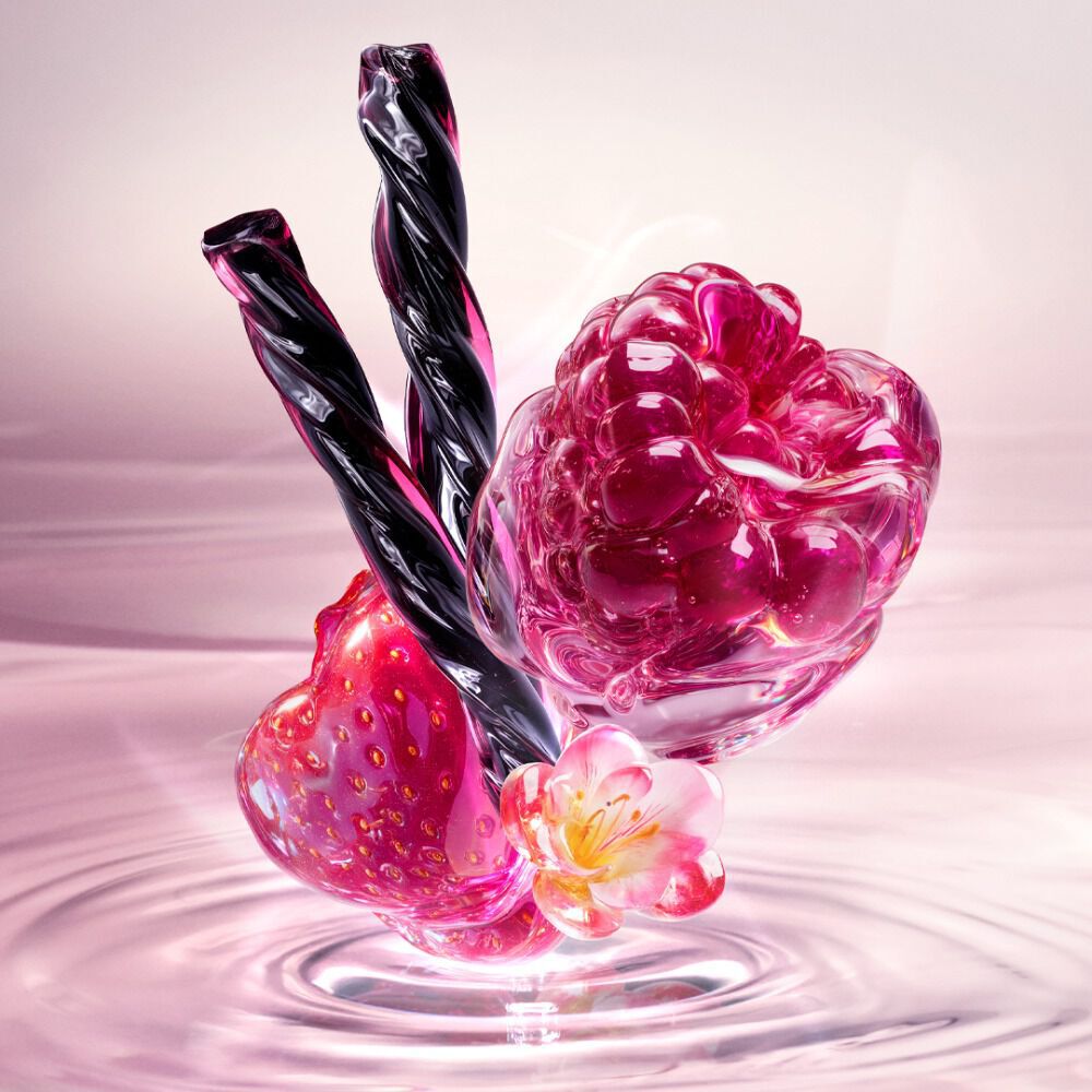 New Starlicious Berry Licorice ingredient video showcasing its key ingredients: a glossy red strawberry, a vibrant raspberry, a delicate pink flower, and twisted black licorice sticks, all set against a soft pink rippling water background.
