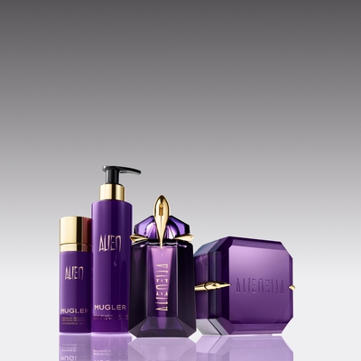 Collection of Mugler Alien fragrance and body care products, featuring elegant purple packaging against a gradient background.
