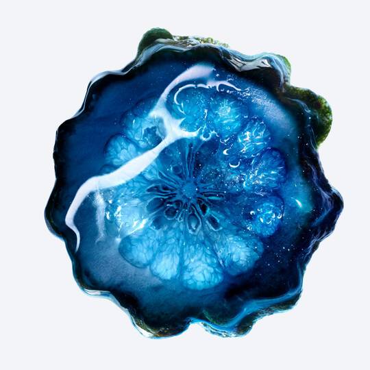 Close -up of deep bue swirl, representing one of Angel Stellar Eau de Parfum's key ingredients, Bergamot