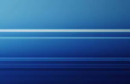 Three perfume bottles in various colors (pink, blue, and purple) are displayed against a gradient blue background, featuring sleek and modern designs.