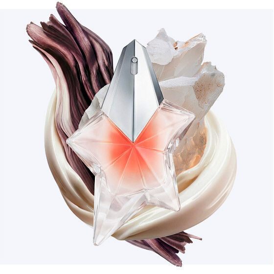 The Angel Blush star bottle surrounded by creamy almond milk swirls, textured sandalwood, and radiant musks, illustrating the fragrance's key olfactory notes.