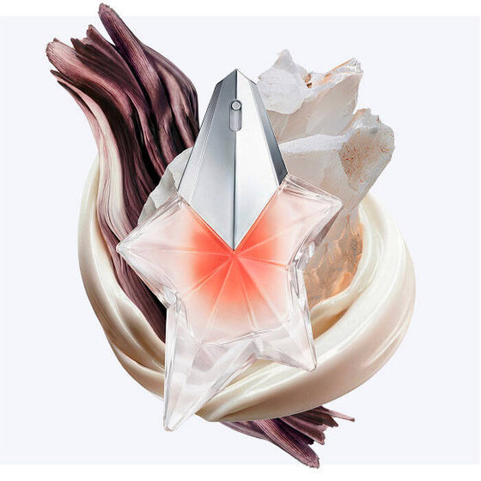 The Angel Blush star bottle surrounded by creamy almond milk swirls, textured sandalwood, and radiant musks, illustrating the fragrance's key olfactory notes.