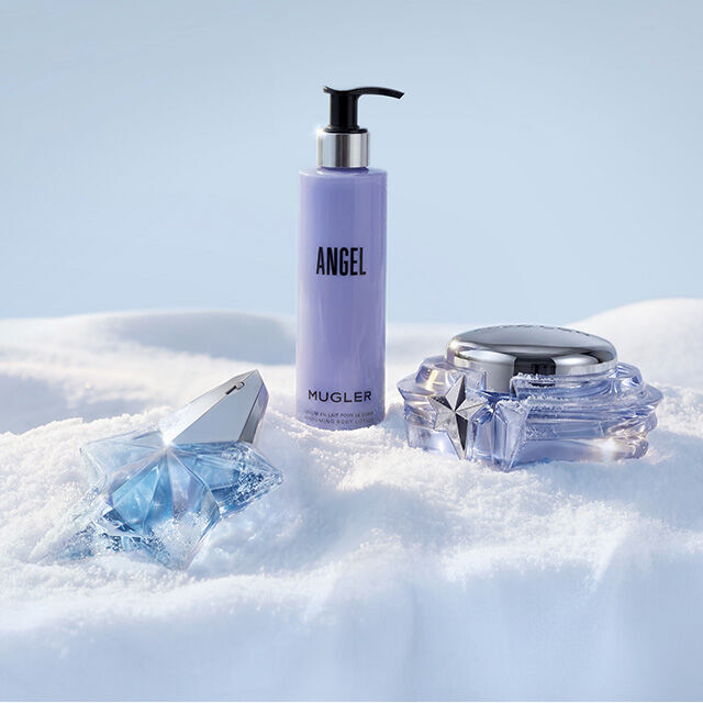 Mugler Angel fragrance and body care collection set in snow. text reads " the rituals"