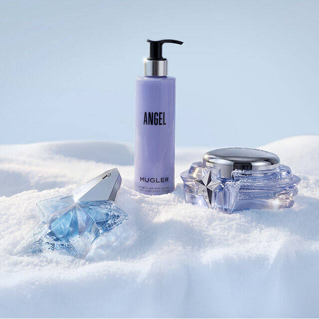 Mugler Angel fragrance and body care collection set in snow. text reads " the rituals"