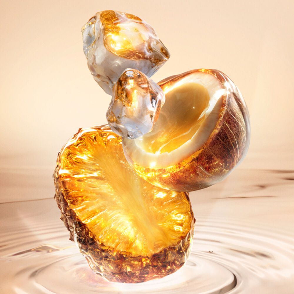 New Starlicious Pineapple Musk ingredient video showcasing its key ingredients: a glowing pineapple slice, a cracked coconut shell, and crystalline musk, all set against a warm, luminous rippling water background.