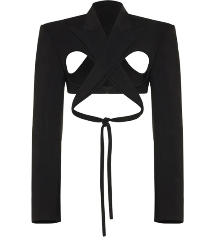 A unique black cropped blazer featuring cut-out detailing and a tie at the waist, designed with a modern, avant-garde style.