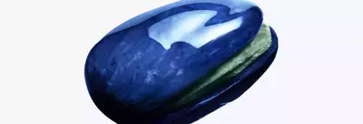 close-up of a pistachio in a mugler-branded cosmic shell.