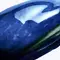 close-up of a pistachio in a mugler-branded cosmic shell.