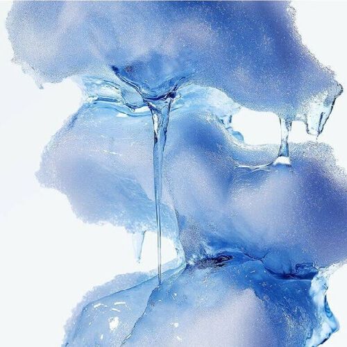Close-up of melting textured blue ice with clear liquid dripping down against a white background.