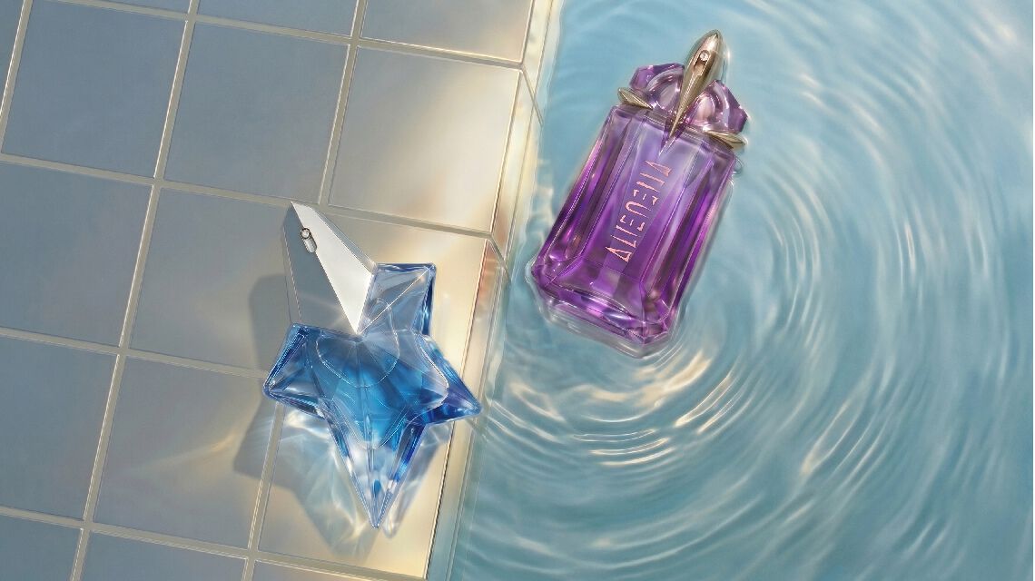 two alien bottles by a swimming pool