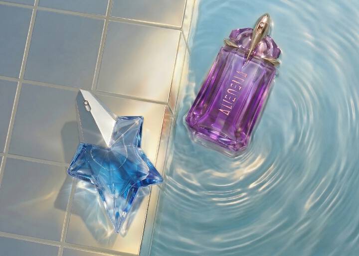 two alien bottles by a swimming pool