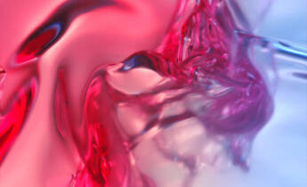 Abstract image featuring flowing liquid in shades of red and blue, creating a smooth, textured appearance with a sense of movement.