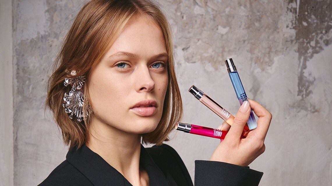 model holding 3 10ml fragrances