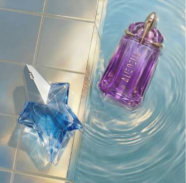 two alien bottles by a swimming pool