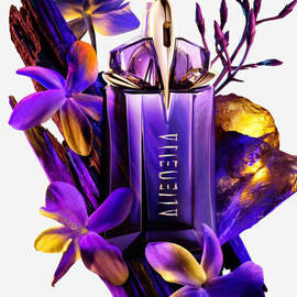 Alien eau de parfum bottle with ingredients surrounding it