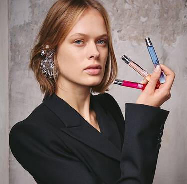 model holding 3 10ml fragrances