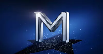 Shiny, metallic letter "M" on a deep blue background with a sparkle effect.