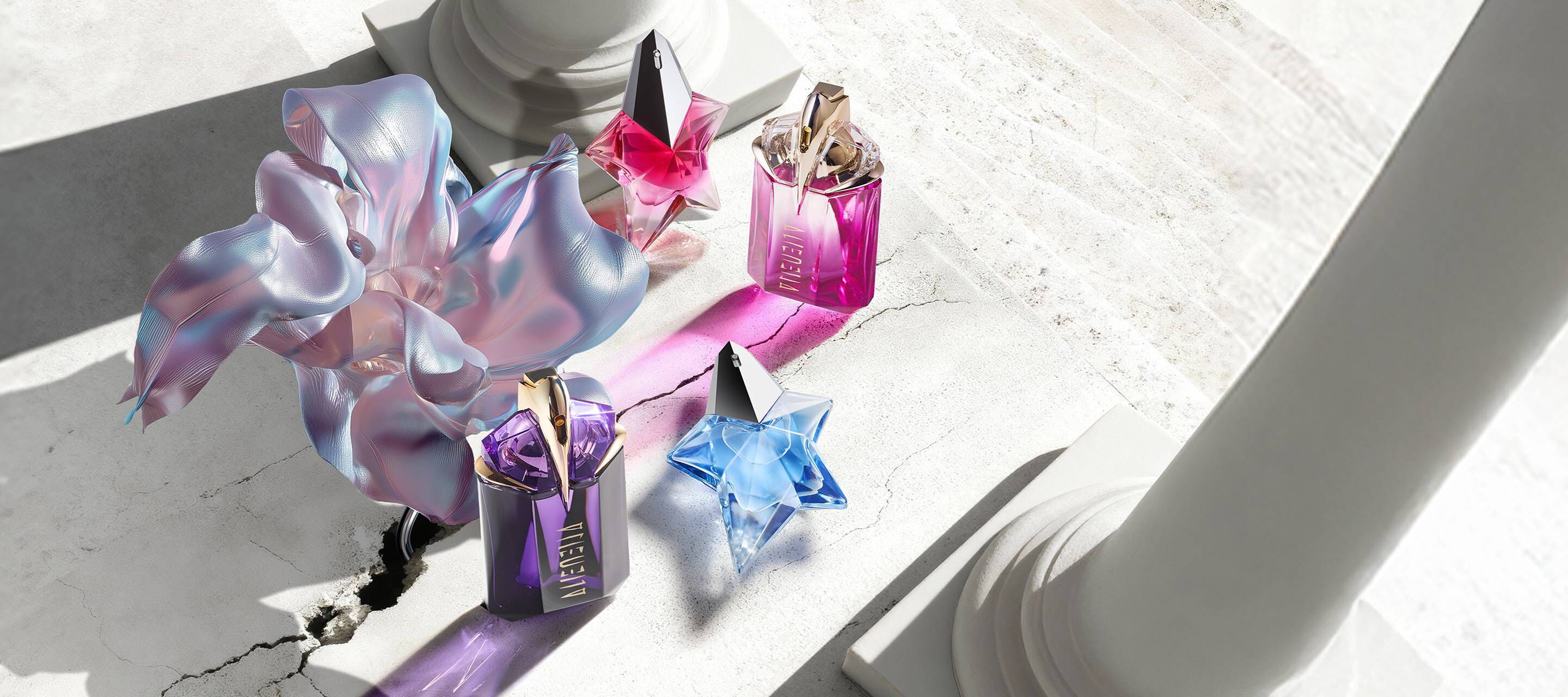 Mugler Mother's Day 2026 campaign banner featuring the iconic Angel and Alien franchise perfume bottles in a celestial floral and Parisian landscape, celebrating extraordinary mothers.
